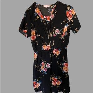 Stella tweed black dress with roses around it